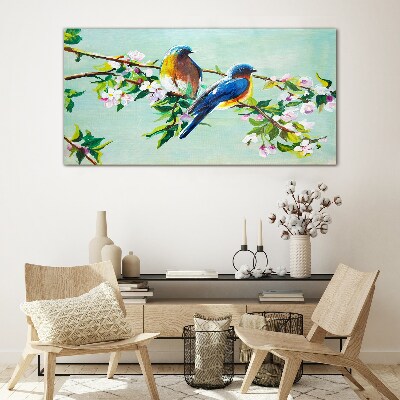 Glasbild Vögel auf einem blühenden Zweig