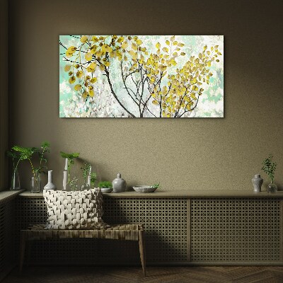 Glasbild Frühlingsblätter vor dem blauen Hintergrund