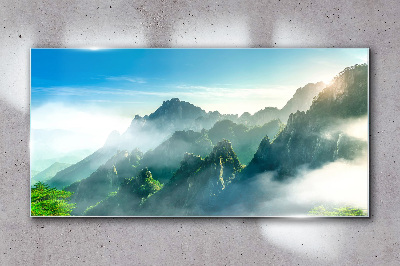 Glasbild Berglandschaft an einem nebligen Morgen