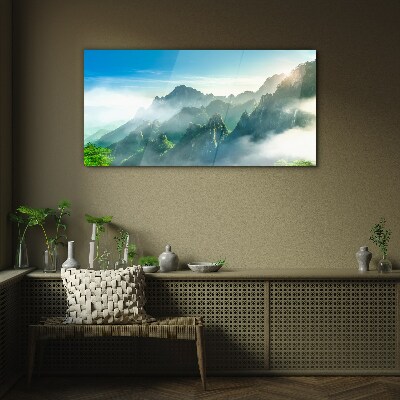 Glasbild Berglandschaft an einem nebligen Morgen