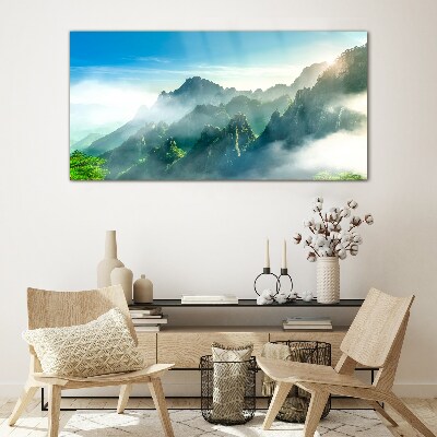 Glasbild Berglandschaft an einem nebligen Morgen