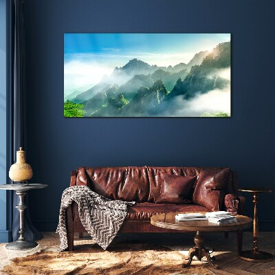 Glasbild Berglandschaft an einem nebligen Morgen