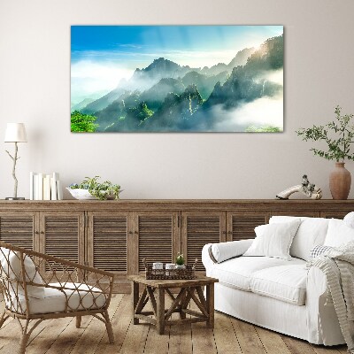 Glasbild Berglandschaft an einem nebligen Morgen