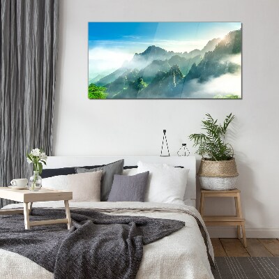 Glasbild Berglandschaft an einem nebligen Morgen