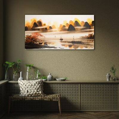 Glasbild Eine friedliche Landschaft mit Bergen und Wasser