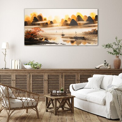 Glasbild Eine friedliche Landschaft mit Bergen und Wasser