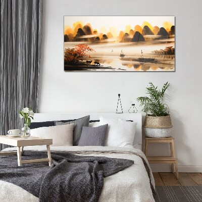 Glasbild Eine friedliche Landschaft mit Bergen und Wasser