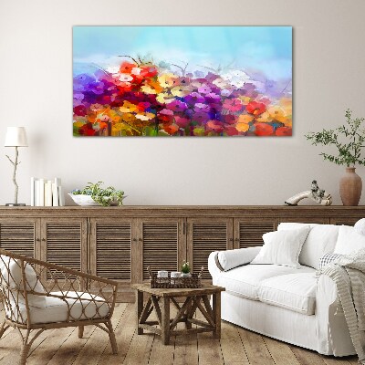 Glasbild Farbenfrohe Blumenlandschaft im Frühling