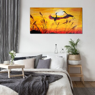 Glasbild Tanzende Kraniche bei Sonnenuntergang