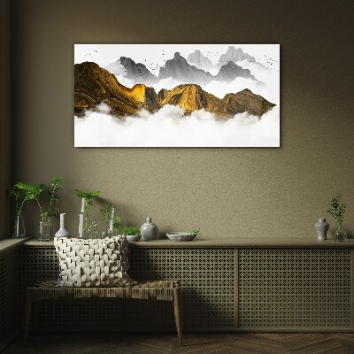Glasbild Goldene Berge in den Wolken