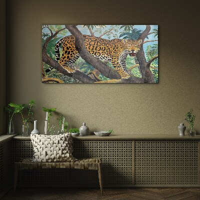 Glasbild Jaguar in einem tropischen Wald
