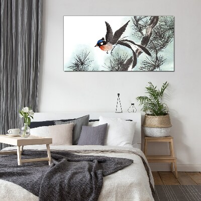 Glas bild Ein Vogel im Flug über den Kiefern