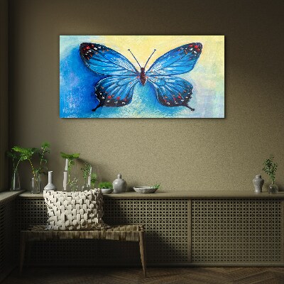 Glasbild Blauer Schmetterling auf abstraktem Hintergrund