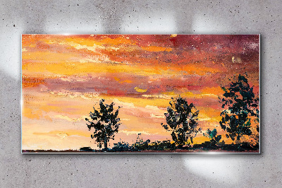 Glasbild Sonnenuntergang über den Bäumen