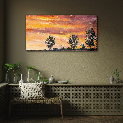 Glasbild Sonnenuntergang über den Bäumen