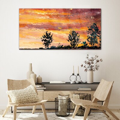 Glasbild Sonnenuntergang über den Bäumen