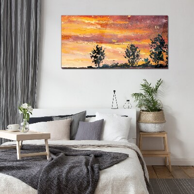 Glasbild Sonnenuntergang über den Bäumen