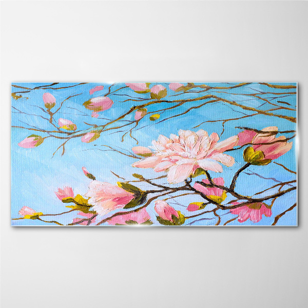Glasbild Magnolienblüten auf blauem Hintergrund