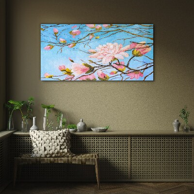 Glasbild Magnolienblüten auf blauem Hintergrund
