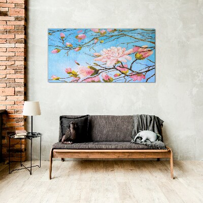 Glasbild Magnolienblüten auf blauem Hintergrund