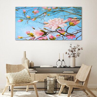 Glasbild Magnolienblüten auf blauem Hintergrund