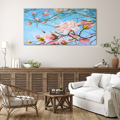 Glasbild Magnolienblüten auf blauem Hintergrund