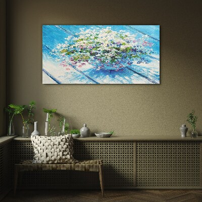 Foto glasbild Blumenkomposition auf blauem Hintergrund