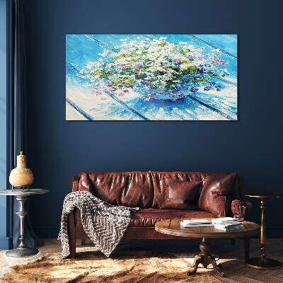 Foto glasbild Blumenkomposition auf blauem Hintergrund