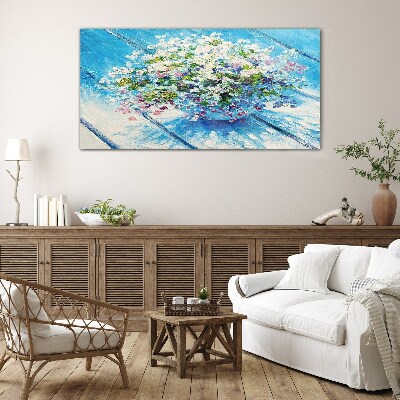 Foto glasbild Blumenkomposition auf blauem Hintergrund