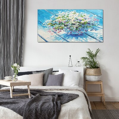 Foto glasbild Blumenkomposition auf blauem Hintergrund
