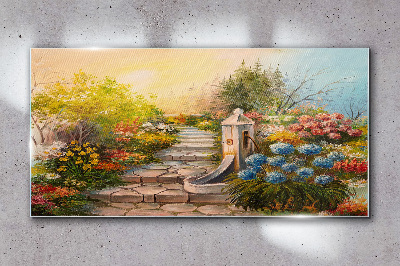 Glasbild Blumengarten mit Springbrunnen