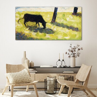Bild auf glas Eine Kuh grast in einer grünen Landschaft