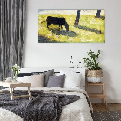 Bild auf glas Eine Kuh grast in einer grünen Landschaft