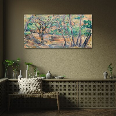 Glasbild Landschaft zwischen den Bäumen