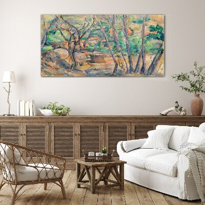 Glasbild Landschaft zwischen den Bäumen