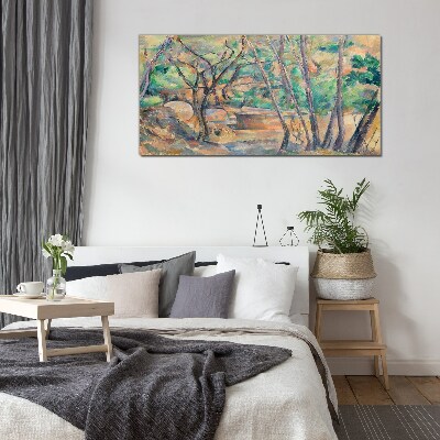 Glasbild Landschaft zwischen den Bäumen