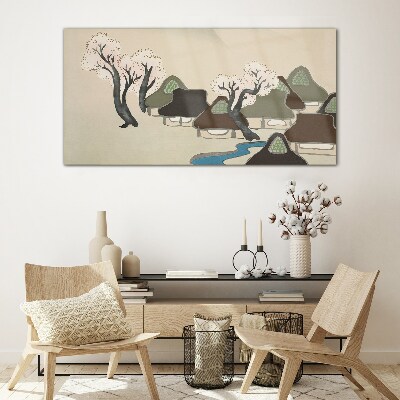 Glasbild Eine friedliche Landschaft mit Häusern und Bäumen