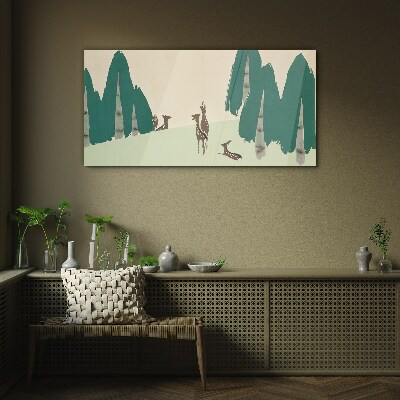 Glasbild Waldhirsche vor dem Hintergrund von Bäumen