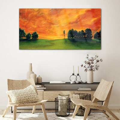 Glasbild Sonnenuntergang über dem grünen Hügel
