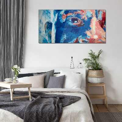 Glasbild Intensives Gesicht in Blautönen