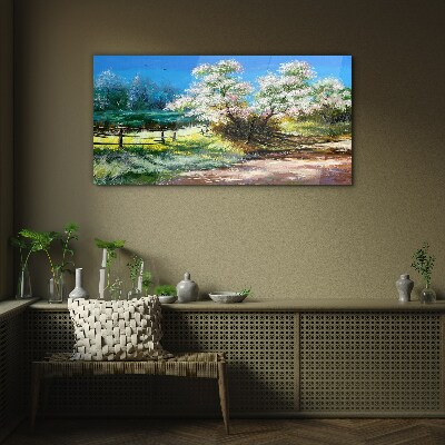 Glasbild Frühlingslandschaft mit blühenden Bäumen