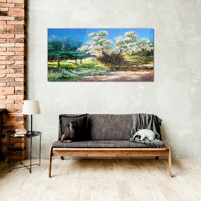 Glasbild Frühlingslandschaft mit blühenden Bäumen