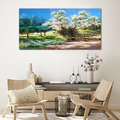 Glasbild Frühlingslandschaft mit blühenden Bäumen