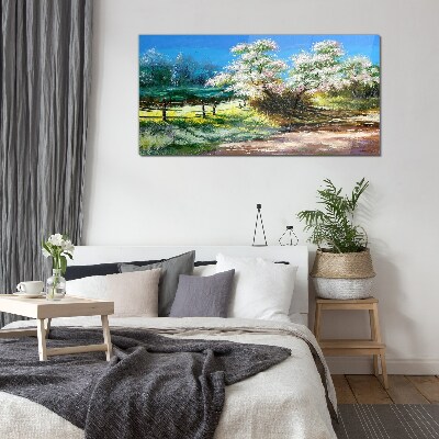 Glasbild Frühlingslandschaft mit blühenden Bäumen