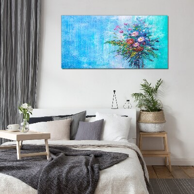 Glasbild Blumenkomposition auf blauem Hintergrund