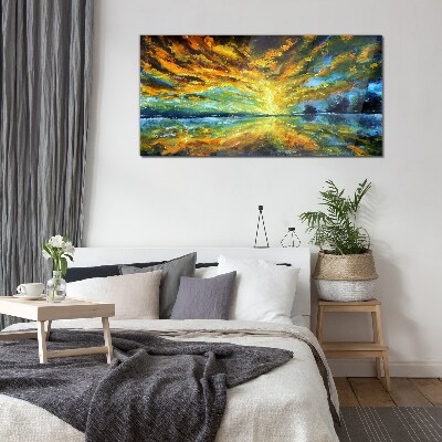 Glasbild Goldene Wolken über ruhigem Wasser