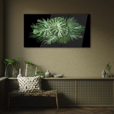 Glasbild Tropisches Grün auf schwarzem Hintergrund