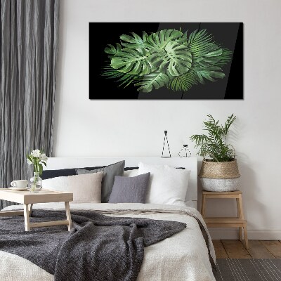 Glasbild Tropisches Grün auf schwarzem Hintergrund