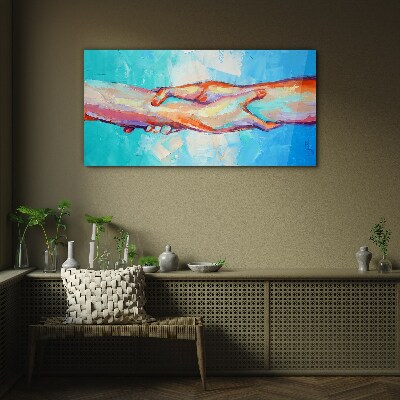 Glasbild Hände in Farbe vereinen