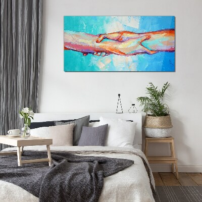 Glasbild Hände in Farbe vereinen